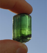 Holding a maine tourmaline crystal